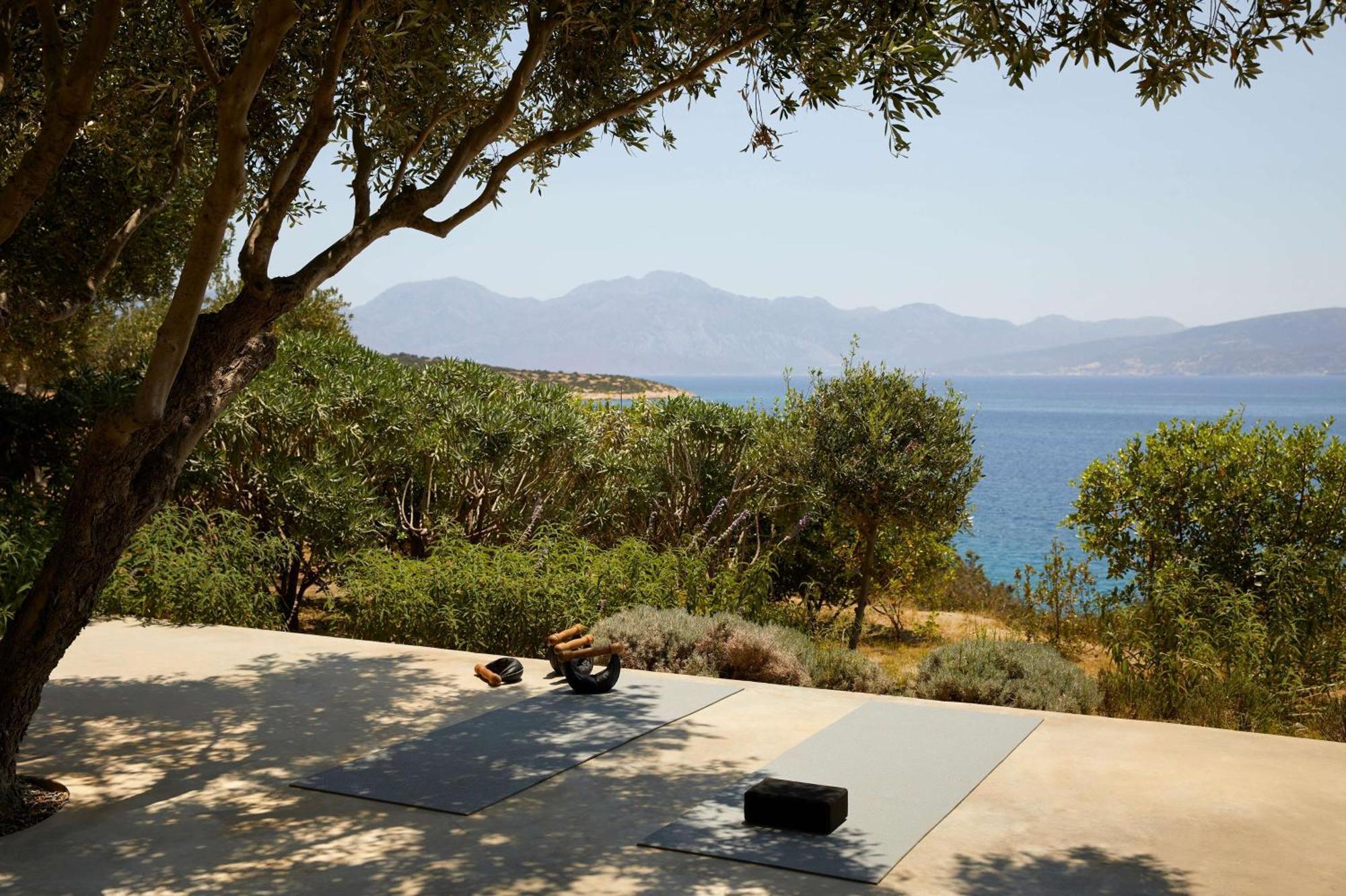 Minos Palace Resort - Adults Only Agios Nikolaos  Exterior photo A woman practicing yoga on a yoga mat